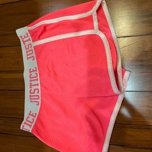 Pink shorts with white letters